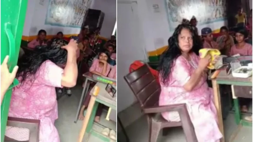 A video captures a teacher in UP applying hair oil in classroom while students observe
