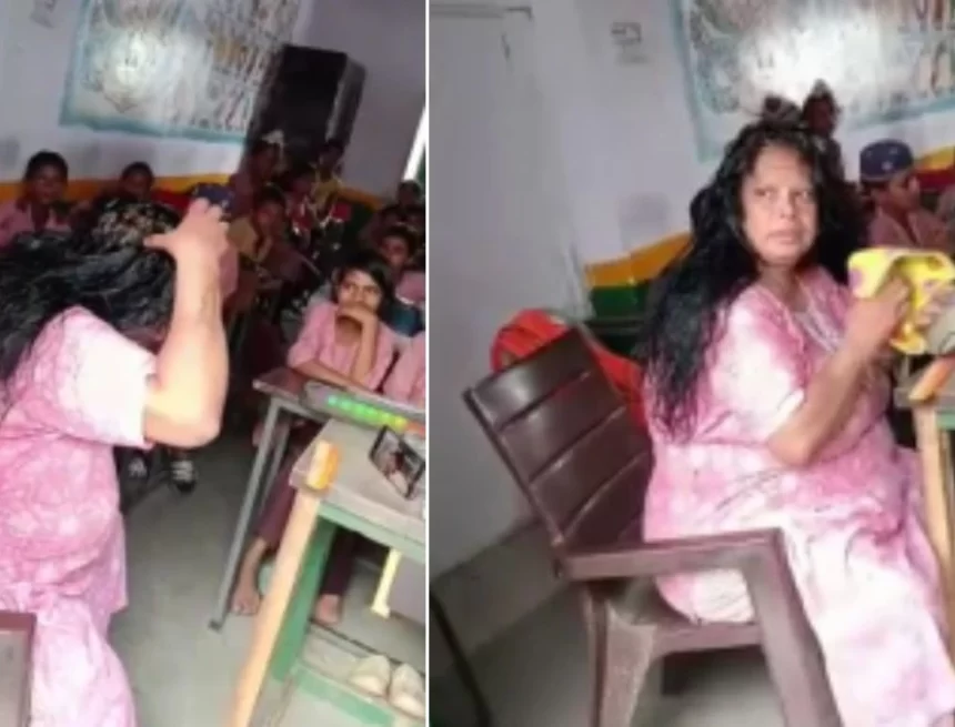 A video captures a teacher in UP applying hair oil in classroom while students observe