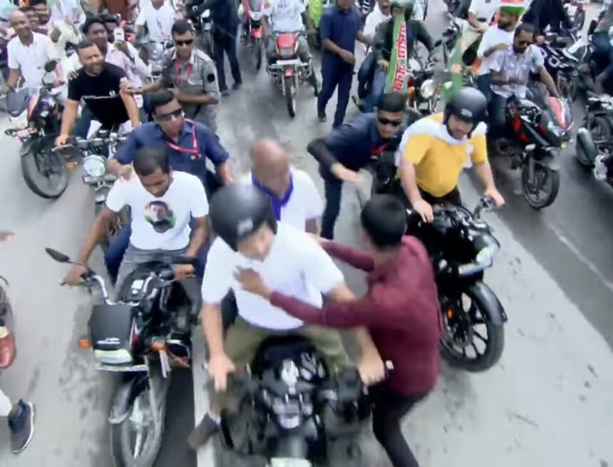 GzGJm6oXQAAvr53 Overexcited Fan Kisses Rahul Gandhi During Bike Rally, Security Breach Sparks Concern