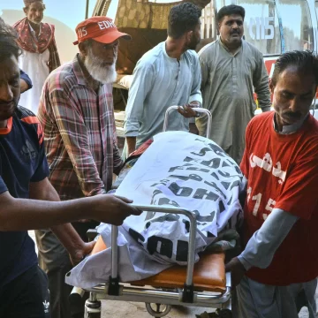 1081656 Tragic Highway Collision in Pakistan Kills 17, Leaves 10 Injured After Van Crashes Into Parked Bus