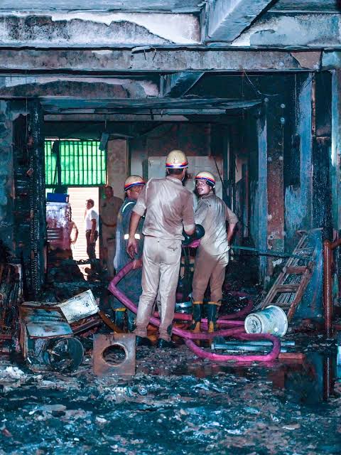 images (55) Two Killed in Noida Apartment Fire as E-Scooter Charging Suspected; Illegal Building Owner Arrested