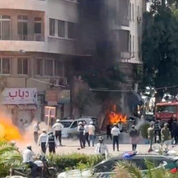 smoke-fire-rise-site-explosive-1093745806 Explosions Near Hotel Housing French President Emmanuel Macron in Damascus Trigger Major Security Alert
