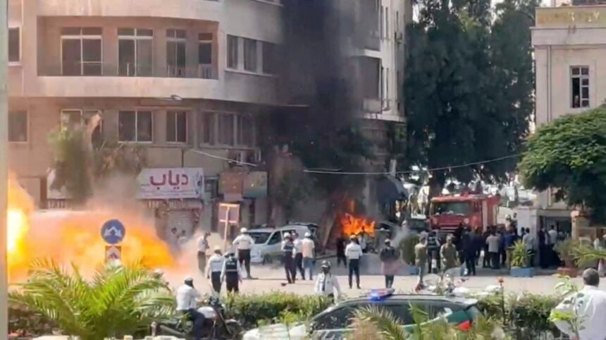 smoke-fire-rise-site-explosive-1093745806 Explosions Near Hotel Housing French President Emmanuel Macron in Damascus Trigger Major Security Alert