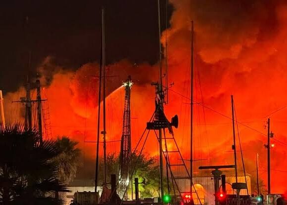 Massive Fire Breaks Out Near Galveston Wharf Road, Emergency Crews Battle Flames as Seafood Restaurant Clarifies Situation
